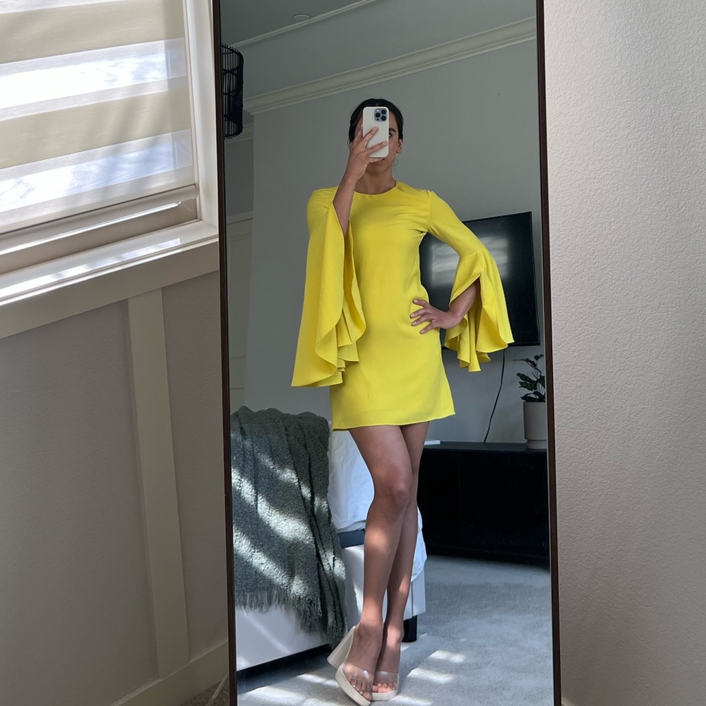 Yellow mini cocktail dress with long sleeves
